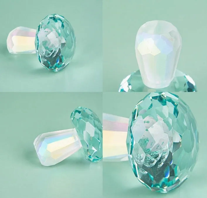 A set of colourful crystal mushroom decorations in transparent, green, red, and yellow on a white surface.