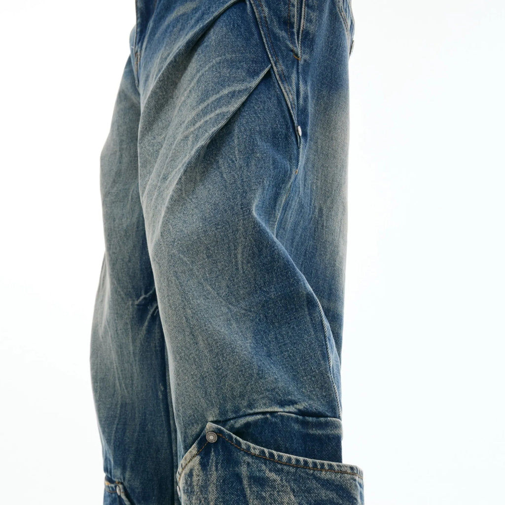Men's verdant blue jeans with retro washed burst pattern and curved knife design on loose fit trousers