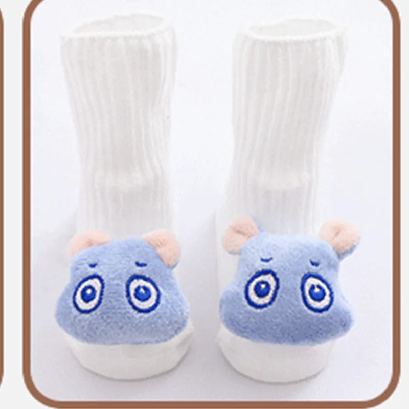 Cotton baby socks in multiple colours and prints including panda, lion, bows, and stars on a white background.