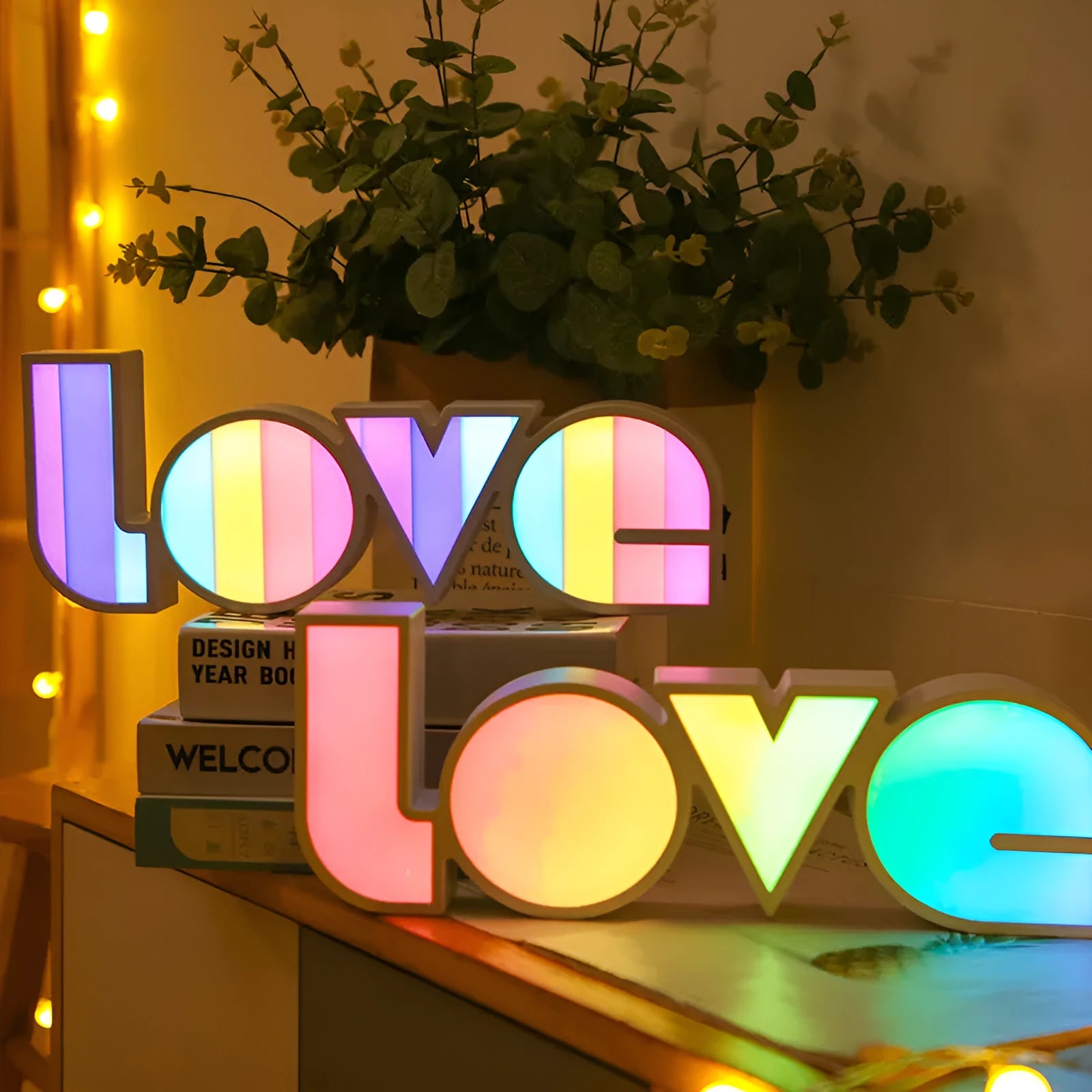 LED decorative light with rainbow-coloured LOVE word on plastic shade