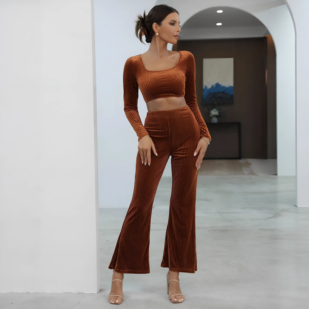 Caramel coloured women's long sleeve sweater and loose trouser co-ord set on a hanger