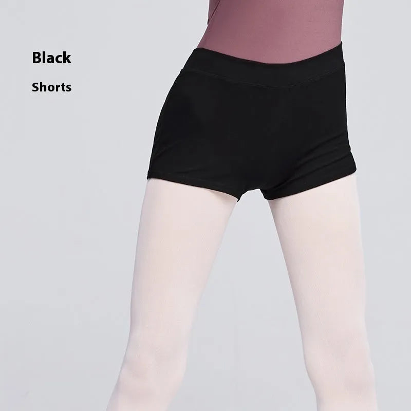 Black cotton dance shorts for women laid flat, showing solid colour and simple design for ballet practice.