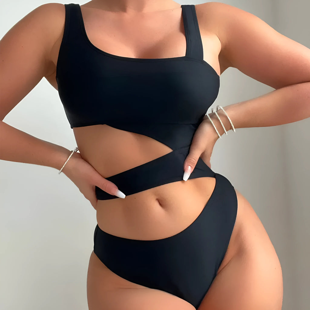 Black solid colour women's one-piece swimsuit with high-cut legs and a hollow back design.