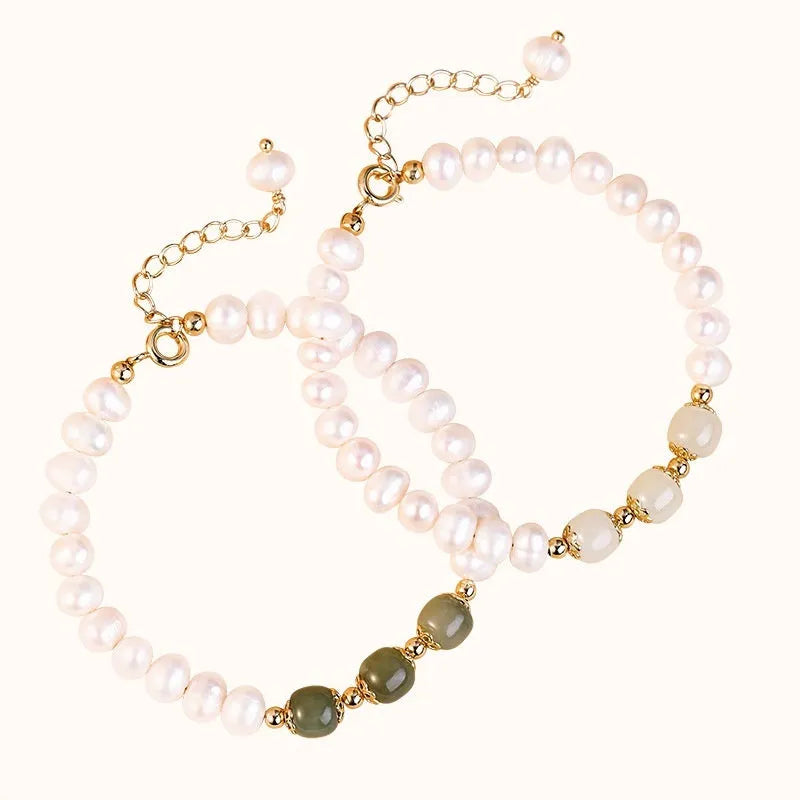 Natural freshwater pearl bracelet with diamond-shaped beads in Hetian jade colour on wrist