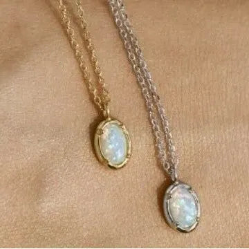 Geometric oval jelly opal pendant necklace on a chain in gold or silver tone.