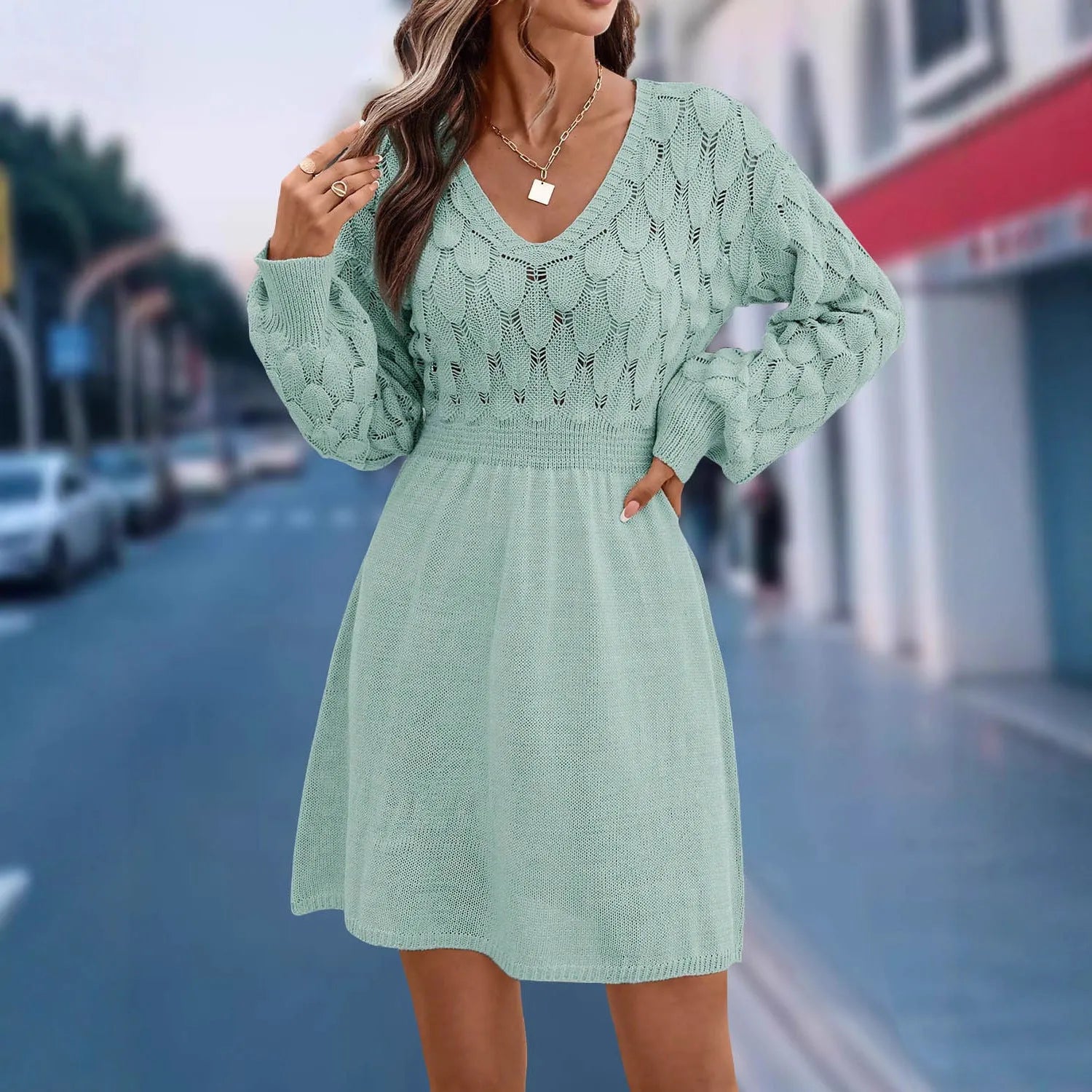 Artistic retro V-neck beach dress with long sleeves, 3D pattern, and high waist in light blue green.