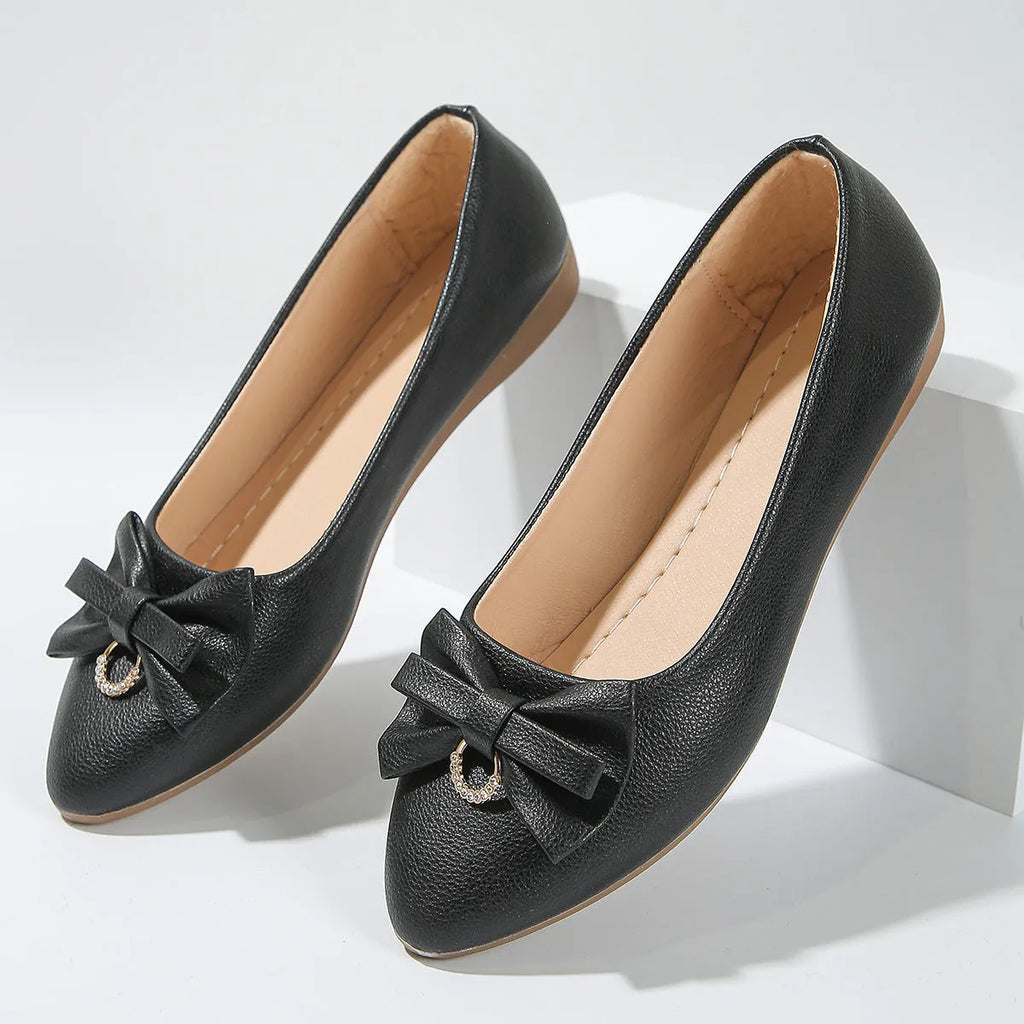 Women's beige casual flat shoes with a bowknot and round toe, showing the shallow mouth design.