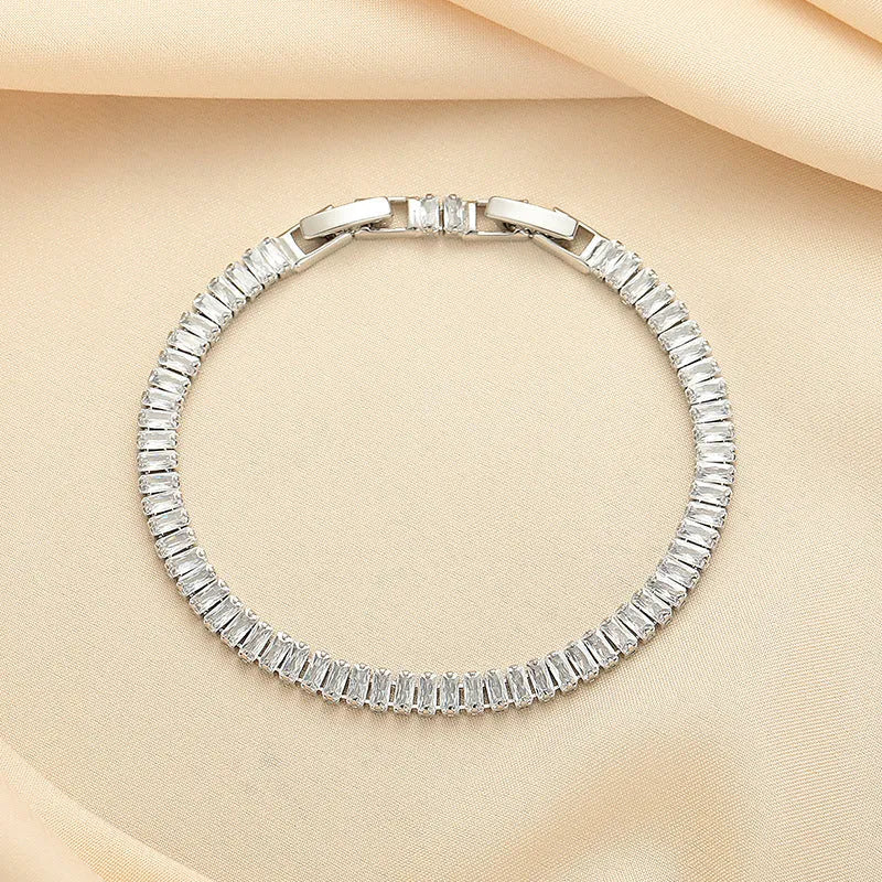 Geometric brass bracelet with quadrilateral full diamond zircon inlay in champagne gold colour