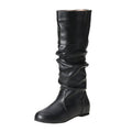 Women's slip-on knee high flat boots in artificial PU upper with round toe and rubber sole