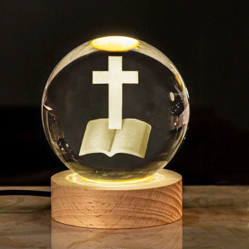 White crystal cross ornament with 6cm ball on wooden warm light base
