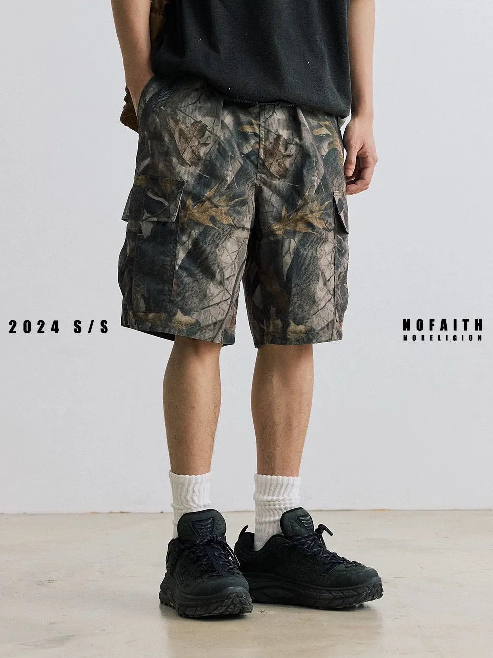 Men's loose fit straight-leg denim shorts in army green colour with a mid waist and zip fly.