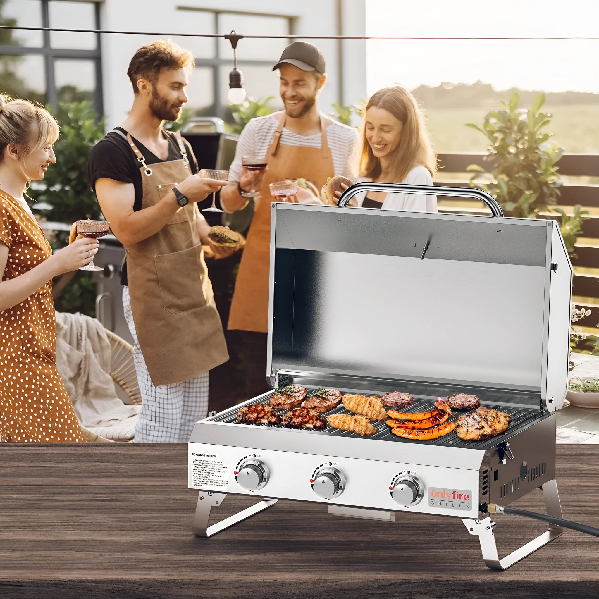 Silver portable desktop gas barbecue grill with three burners and foldable legs.