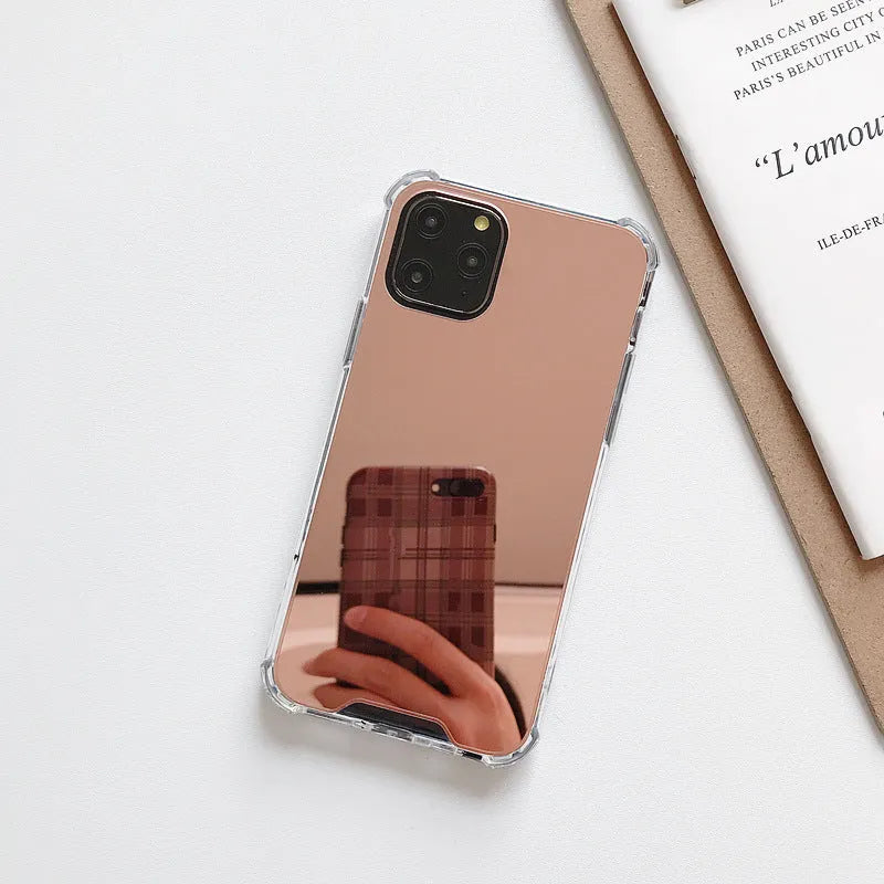 Silver mirror finish hard PC phone case for Apple iPhone on a table.