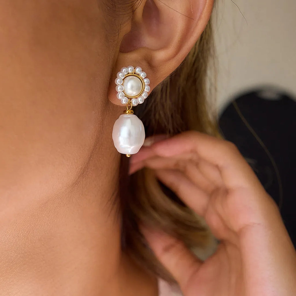 Women's stainless steel light pearl ear studs, geometric shape, electroplated finish, one pair.