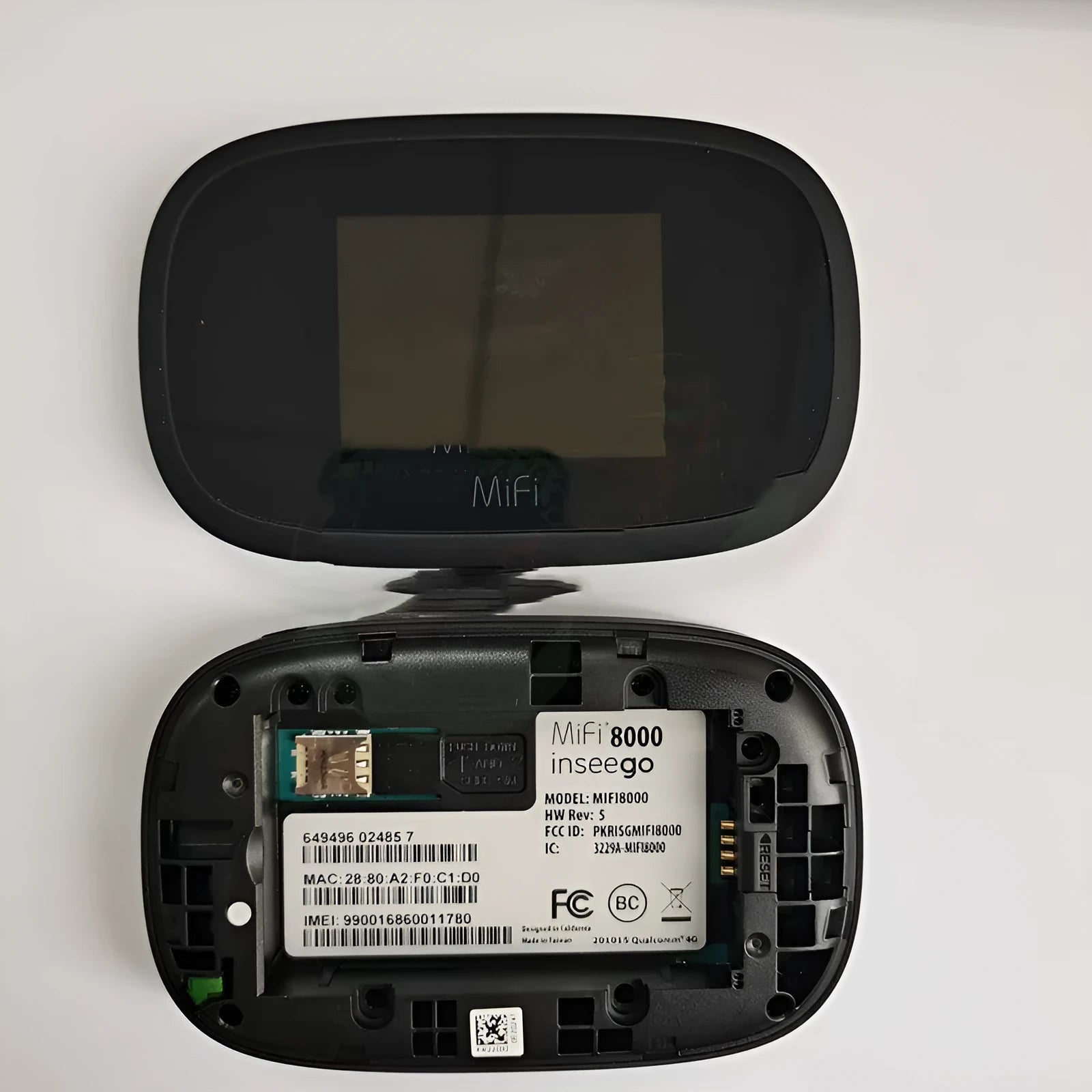 Black MiFi8000 4G portable wireless router with battery and data cable.