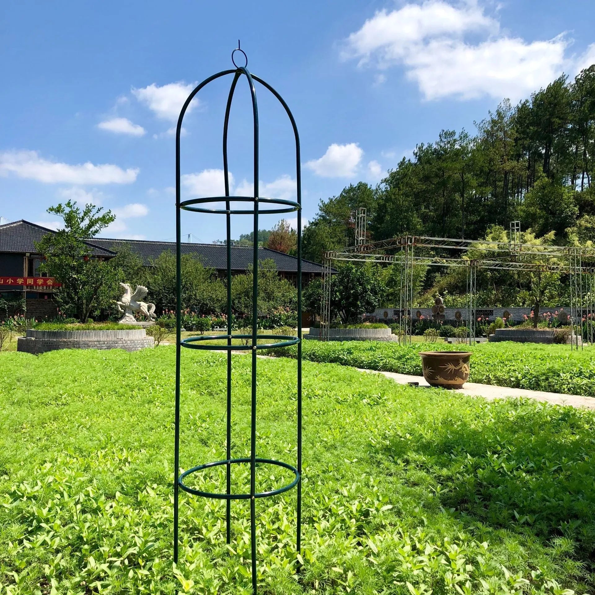 Dark green wrought iron climbing plant frame with grid lattice design