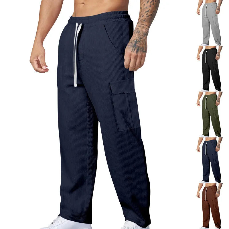 Men's corduroy cargo trousers in loose fit wide-leg design with elastic waist