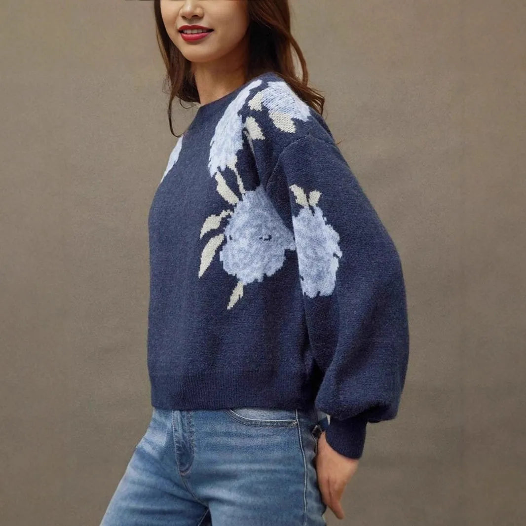 Sapphire blue women's loose pullover with woven floral jacquard pattern on chenille fabric.
