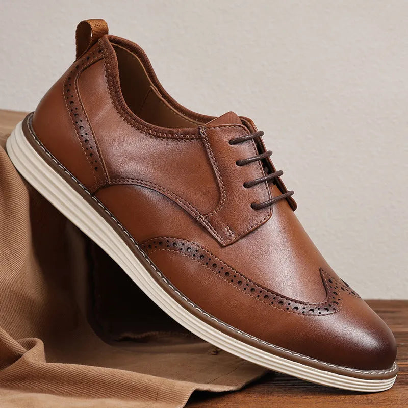 Men's black slip-on business casual shoes with decorative carving details on PU leather upper
