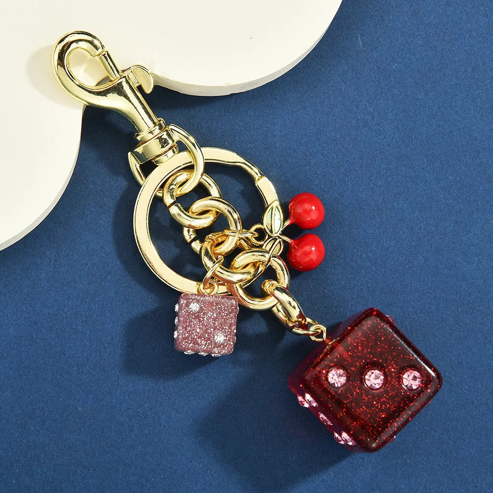 Square metal dice bag keychain pendant with cherry two-tone electroplated finish