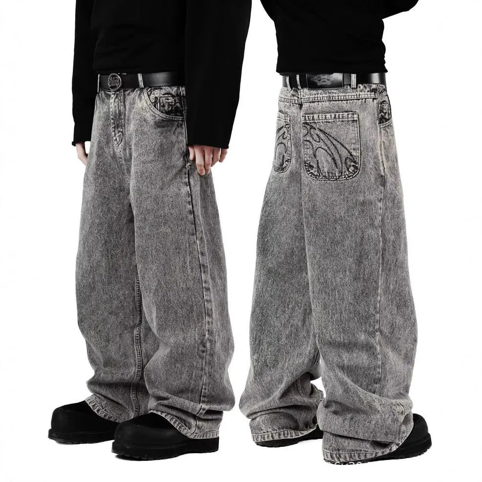 Grey loose-fit straight-leg cotton denim trousers on a hanger.