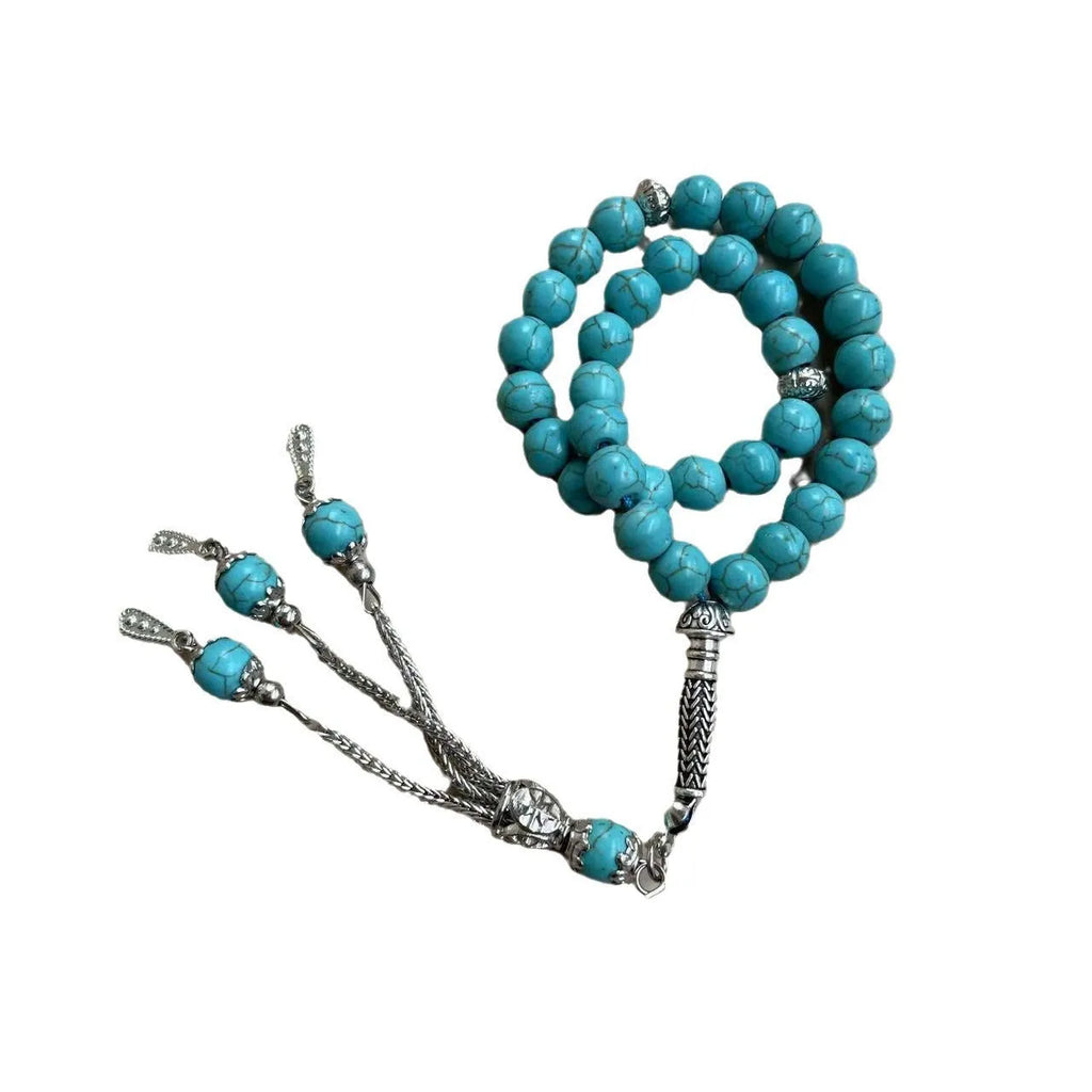 Handmade sky blue stone Muslim prayer bracelet with 8mm beads on a wrist.
