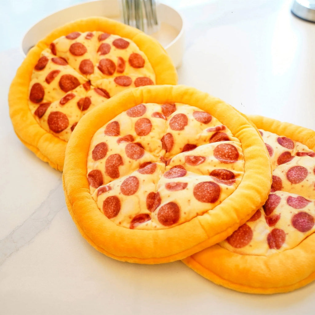 Yellow teddy bear dog chew toy holding a pizza slice with a squeaker inside.