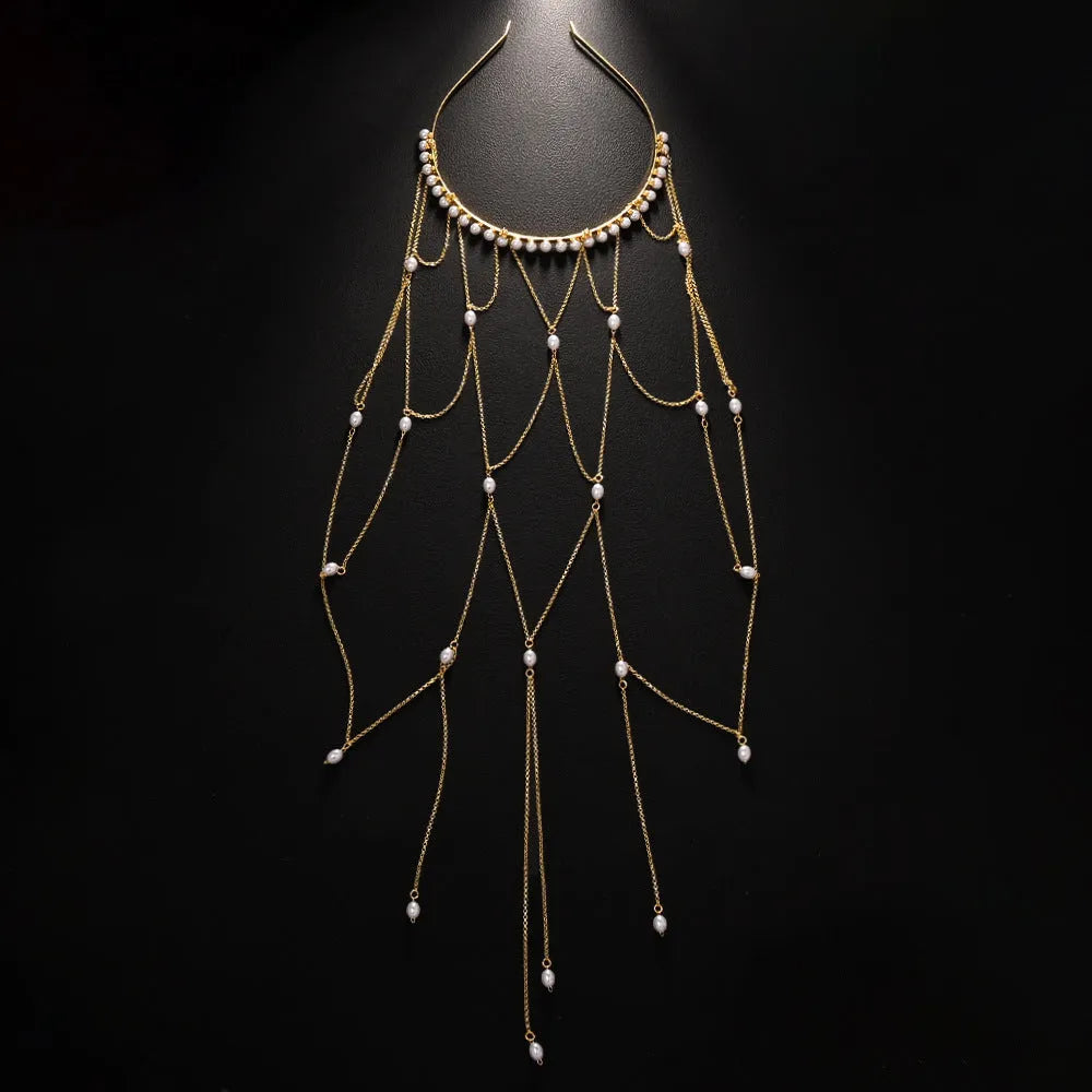 Women's gold mesh hair chain with tassel and pearl decorative elements.