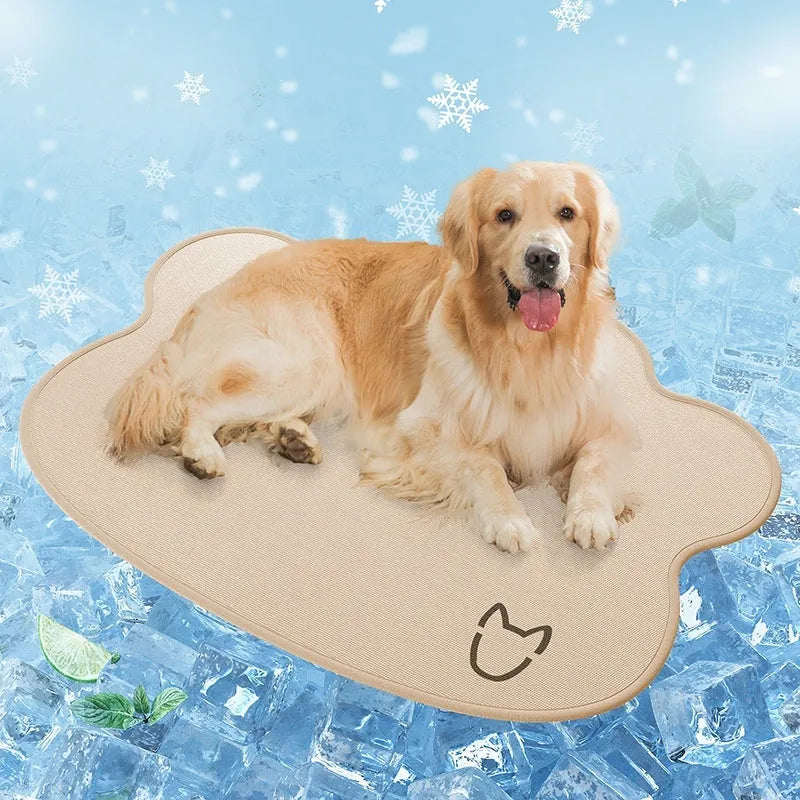 Iced silk pet cooling mat in dark grey with a simple dog head shape, shown on a hardwood floor.