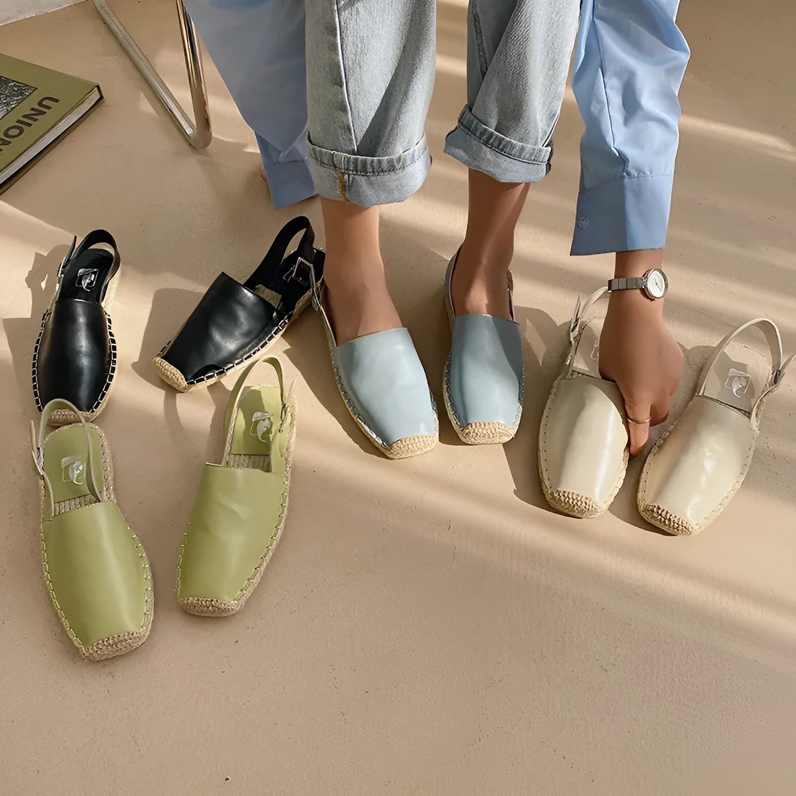 Women's beige retro fisherman flat sandals with canvas and soft leather upper, flat sole, and animal pattern detail.
