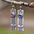 Antique finish gold tone geometric ellipse earrings with red sapphire stone accent