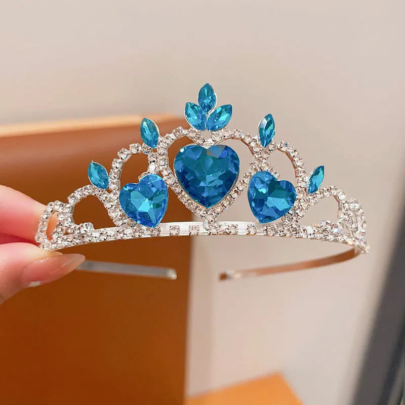 Children's electroplated alloy metal headband with crown shape and crystal decoration in pink, blue, or purple.