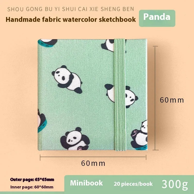 Feiluniao handmade fabric watercolour notebook in 185mm portable size, showing artistic cover design.