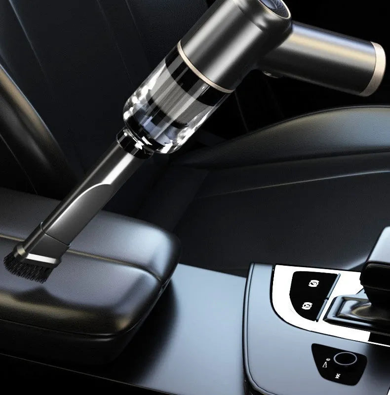 Black wireless handheld car vacuum cleaner with multiple nozzle attachments on a white background.