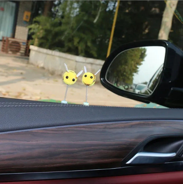 Yellow and black cartoon bee car decoration made from fur ball material measuring 3x3cm