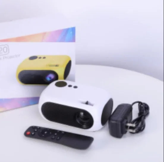 M24 micro mini portable LED projector in gold or white colour on a grey background
