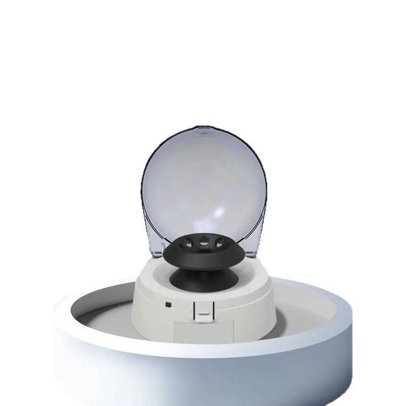 Small white benchtop mini centrifuge laboratory equipment with digital display