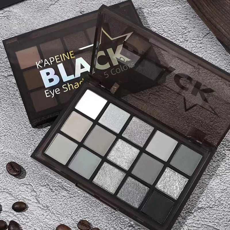 15-colour eye shadow palette showing brown, blue, grey, and black shades with matte and shimmer finishes