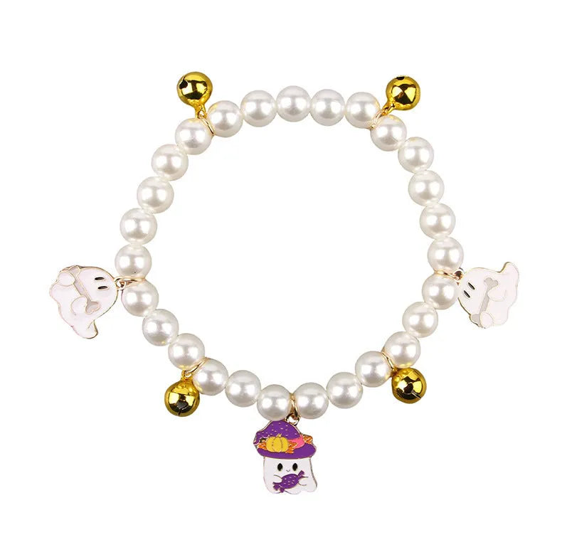 Halloween cat collar with simulated pearl decoration showing purple ghost, skull pumpkin, and smiling pumpkin design options