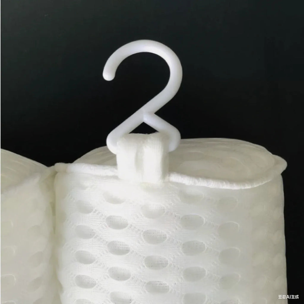 White bathtub pillow with 4D mesh fabric and seven large suction cups on a flat surface.