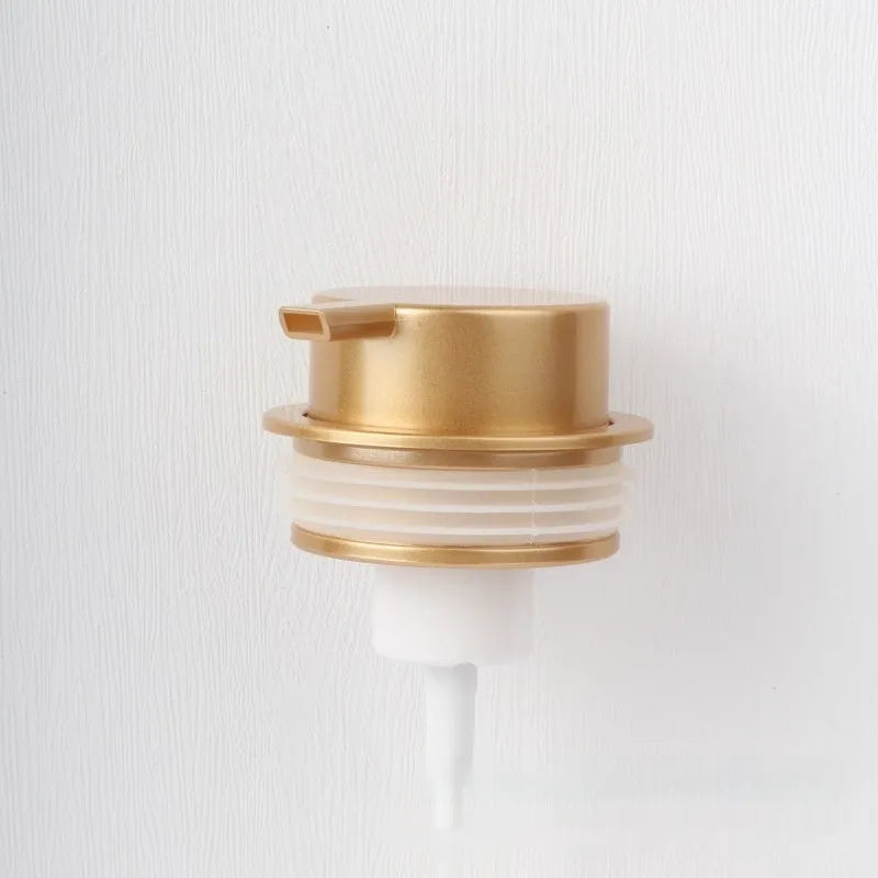 Facial cleanser foam pump with large plastic head in various metallic finish options.