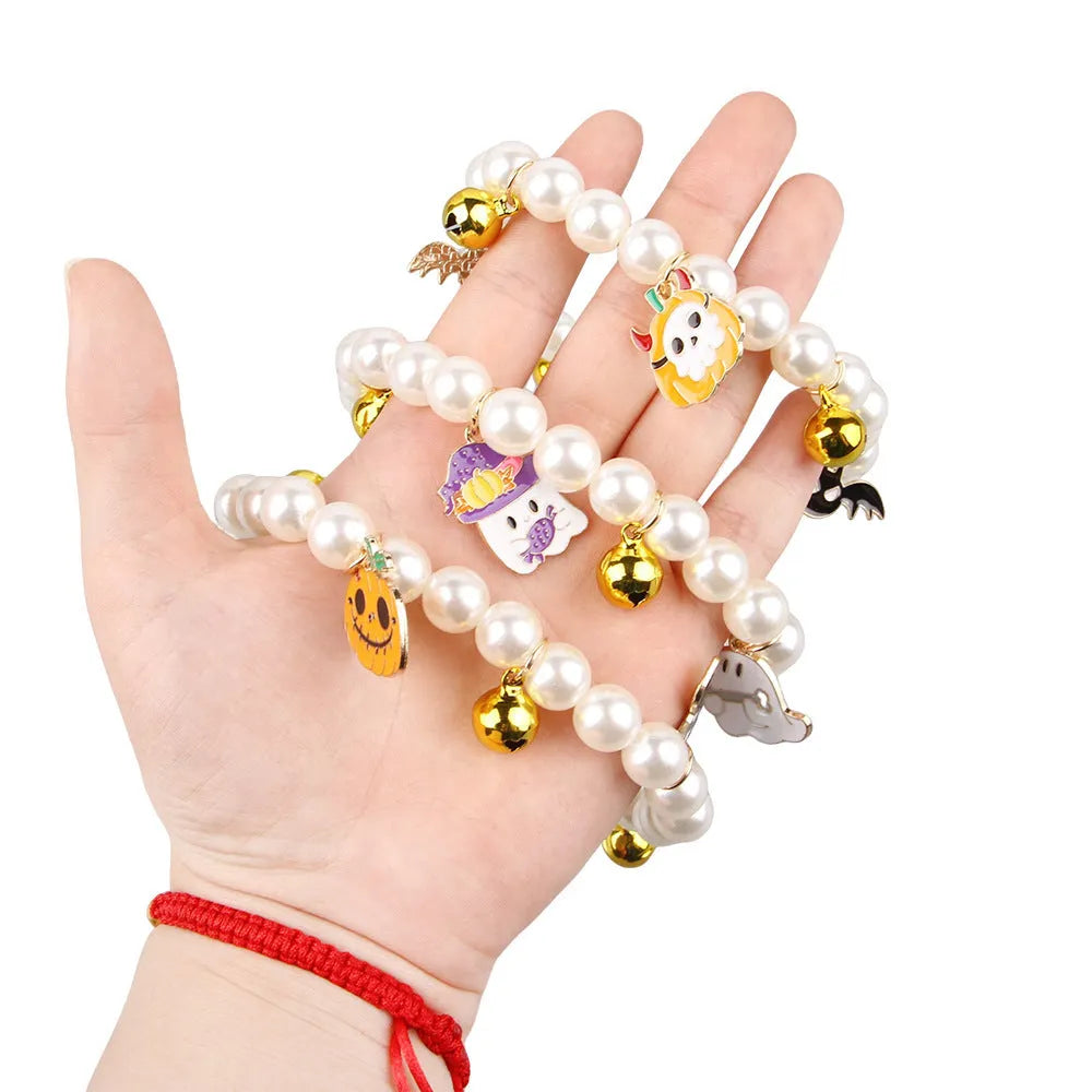 Halloween cat collar with simulated pearl decoration showing purple ghost, skull pumpkin, and smiling pumpkin design options