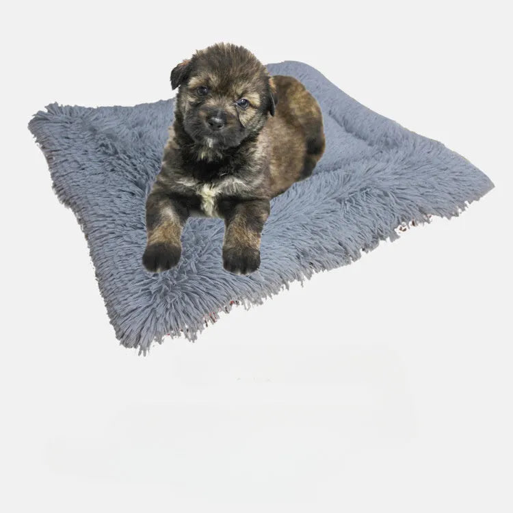Grey or white pet blanket with long plush hair measuring 61cm by 51cm with non-slip black bottom