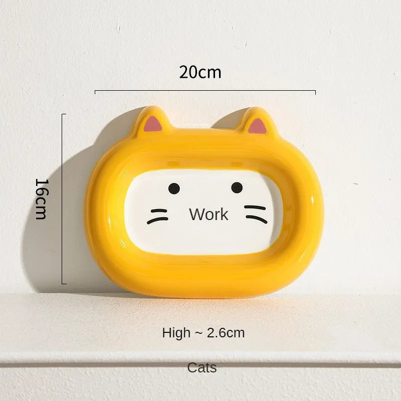 Ceramic pet bowl with an animal design, shown on a table.