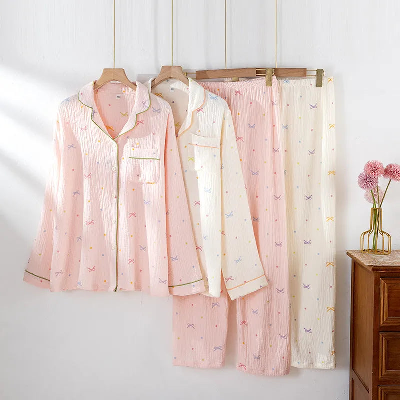 Women's lightweight cotton crepe pyjama set in pink, showing long sleeves and trouser legs.