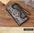 Chinese style brown leather tri-fold wallet with a floral embossed pattern, shown open to reveal compartments.