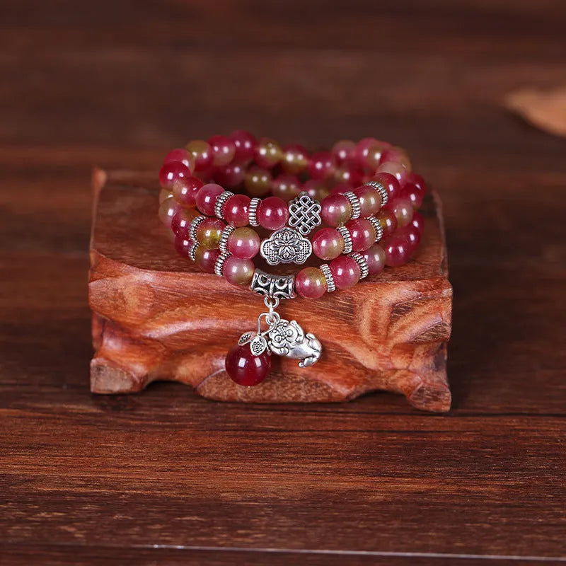 Natural watermelon crystal bracelet with Chinese knot design in 6mm and 8mm bead sizes