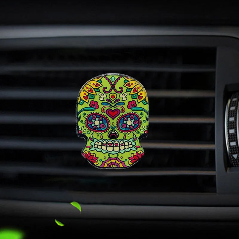Skull-shaped acrylic car air freshener vent clip with mixed fragrance, 3.5-4.5 cm, colour option shown.