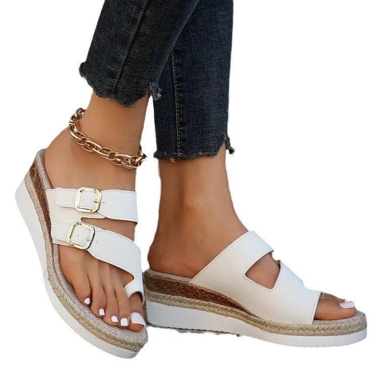 White patent leather wedge sandals with peep toe and woven finger fit straps