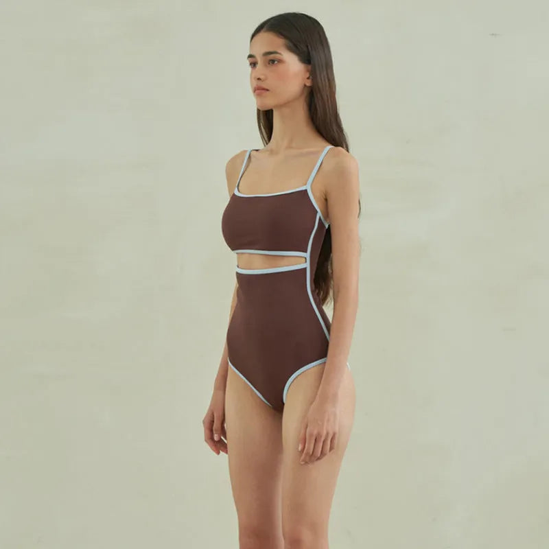 Brown women's one-piece triangle top swimsuit on hanger